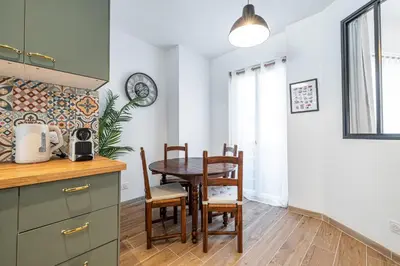 a kitchen and dining room with a table and chairs at Large & Quiet 1 Bdr Downtown in Nice