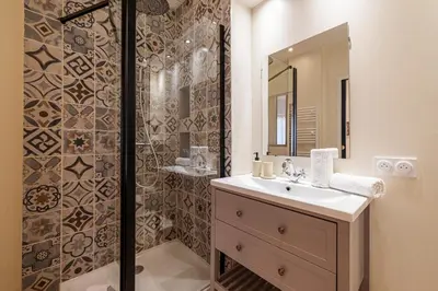 a bathroom with a sink and a shower at Large & Quiet 1 Bdr Downtown in Nice