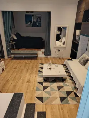 a living room with a bed and a table at La Terrazza in Nice