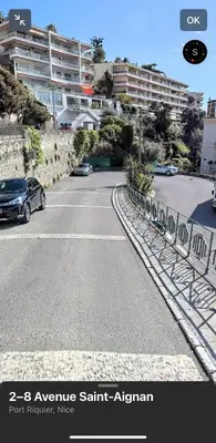 a car parked in a parking lot next to a building at Appartement au port de Nice, proche des plages in Nice