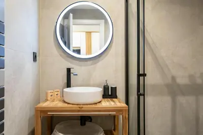 a bathroom with a sink and a mirror at #51 1BDR Massena,central 5 min to the beach AC in Nice