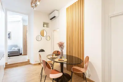 a dining room with a table and chairs at #51 1BDR Massena,central 5 min to the beach AC in Nice