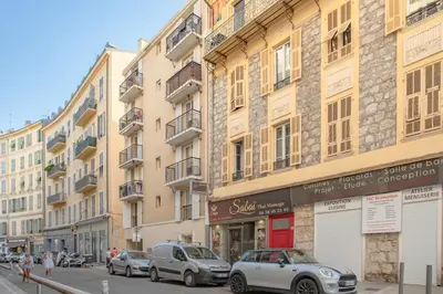 a street with cars parked in front of buildings at #58 Logement Clim & Balcon 5mins marche de la Mer in Nice