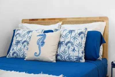 a blue and white bed with blue and white pillows at Nice Renting - 5bFRANCE - Luxurious Apartment Place Massena Promenade des Anglais in Nice