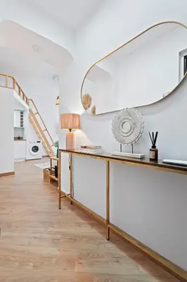 a living room with a desk and a large mirror at Nice Renting - 5bFRANCE - Luxurious Apartment Place Massena Promenade des Anglais in Nice
