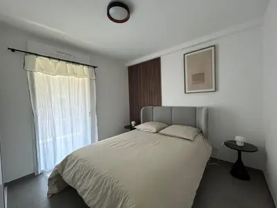 a bedroom with a bed and a window at Sea Breeze By Avecoeur in Nice