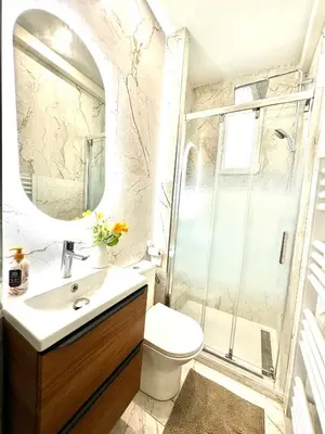 a bathroom with a shower and a sink at Villa Lila in Nice