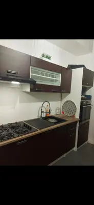a kitchen with a sink and a stove top oven at appartement 10mn à pied plage promenade in Nice