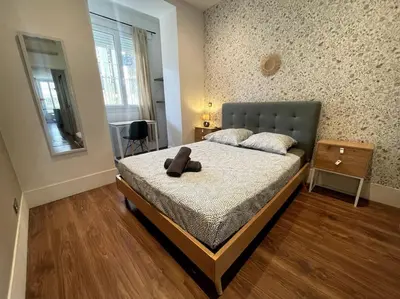 a bedroom with a bed with a teddy bear on it at Appart T3 Clim Hypercentre in Nice