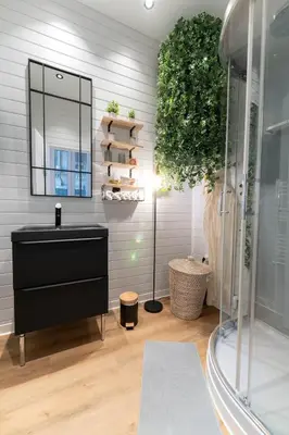 a bathroom with a black sink and a mirror at Riviera Bliss in Nice
