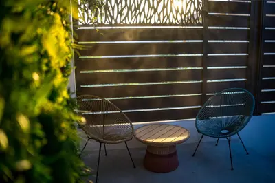 three chairs and a table on a patio at Dolce Vita, Spa, Cagnes Sur Mer in Cagnes-sur-Mer