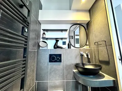 a bathroom with a sink and a mirror at ApartHotel Riviera - LE PETIT BALCON DE L'OPERA - Old Town Promenade des Anglais in Nice