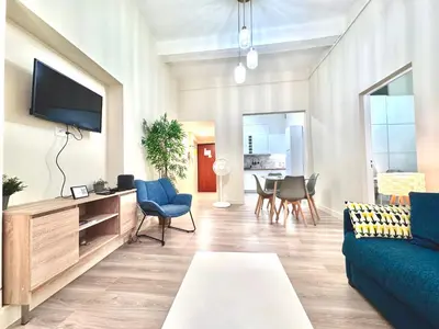 a living room with a green couch and a table at ApartHotel Riviera - COCON DU MOULIN - Old Town Promenade des Anglais in Nice