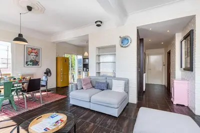 a living room with a couch and a table at PENTHOUSE 2Bedroms 6pax- Views 45m2 Terrace in Nice