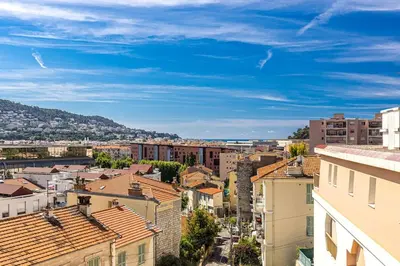 a cityscape of a city with buildings and a blue sky at PENTHOUSE 2Bedroms 6pax- Views 45m2 Terrace in Nice