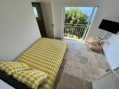 a bathroom with a toilet and a shower and a sink at Entre les citronniers et la mer in Èze