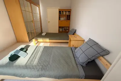 a small room with a bed and a couch at Spacieux appartement climatisé centre Nice in Nice