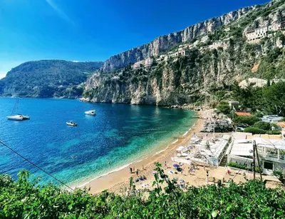a beach with a group of people on the beach at Mala Beach Sea View in Cap d'Ail