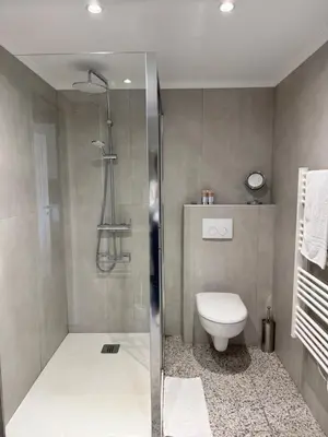 a bathroom with a shower and a toilet at Mala Beach Sea View in Cap d'Ail