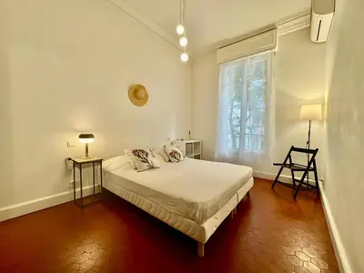 a white bedroom with a bed and a window at 2P Moderne Riquier proche Port, Gare, Tramway in Nice