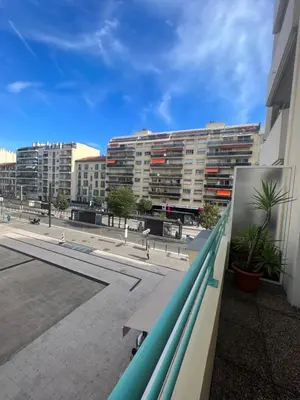 a view of a city from a balcony with surfboards at La Terrasse de Palais des Arts in Nice