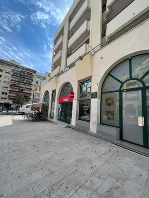 an empty street in front of a building at La Terrasse de Palais des Arts in Nice