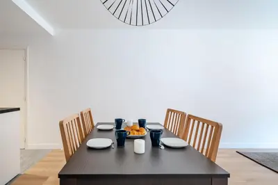 a dining room table with chairs and a plate of food on it at Near old town and apartment fully renovated in Nice