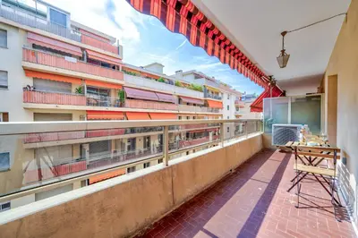a balcony of a building with a table on it at Near old town and apartment fully renovated in Nice