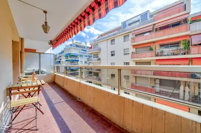 a balcony of a building with a table on it at Near old town and apartment fully renovated in Nice