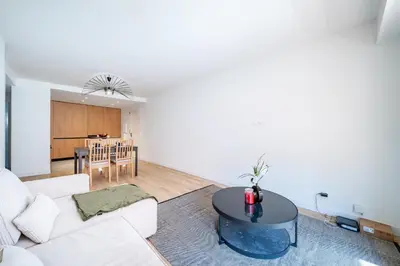 a living room with a white couch and a table at Near old town and apartment fully renovated in Nice