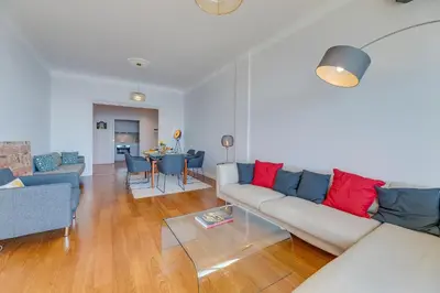 a living room with a couch and a table at LE 3 PROMENADE AP4424 By Riviera Holiday Homes in Nice