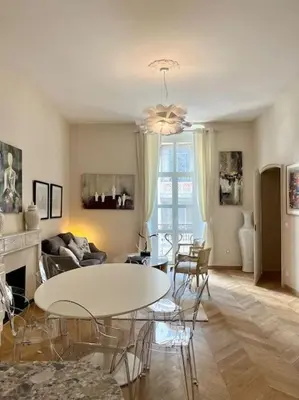 a living room with a white table and chairs at Vera Nizza in Nice