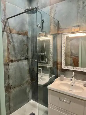 a bathroom with a shower and a sink at Vera Nizza in Nice