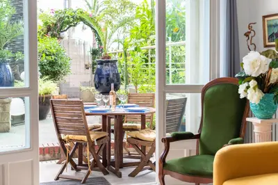 a dining room with a table and chairs at Happyfew La Promenade 53 in Nice