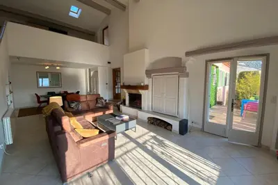 a living room with a couch and a fireplace at 06C-Villa for 8 persons with pool near Nice in Tourrette-Levens