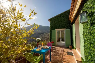 a table on the balcony of a house at 06C-Villa for 8 persons with pool near Nice in Tourrette-Levens