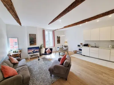 a living room with two couches and a kitchen at 