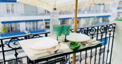 a shopping cart with plates and candles on it at 3P neuf et climatisé Nice le Port à 9mn de la mer in Nice