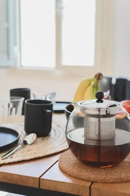 a kitchen counter with a tea pot on a table at Bohème-Chic au cœur du VIEUX NICE #Lovely in Nice