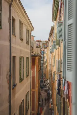 a view of an alley between two buildings at Bohème-Chic au cœur du VIEUX NICE #Lovely in Nice