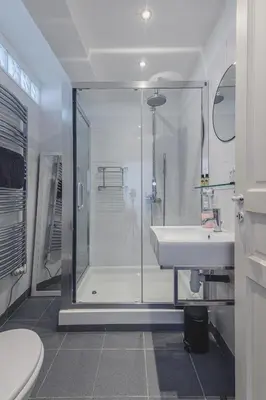 a white bathroom with a shower and a sink at Bohème-Chic au cœur du VIEUX NICE #Lovely in Nice