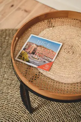 a magazine sitting on top of a table at Bohème-Chic au cœur du VIEUX NICE #Lovely in Nice