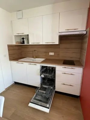 a kitchen with a dishwasher in the middle of it at Studio avec jardinet proche mer in Cagnes-sur-Mer