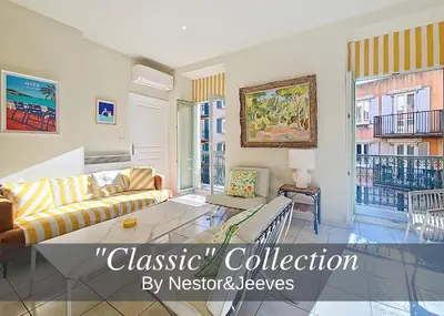 a living room with a couch and a table at Nestor&Jeeves - PALAIS DU PORT - Balcony - Port Place du Pin in Nice