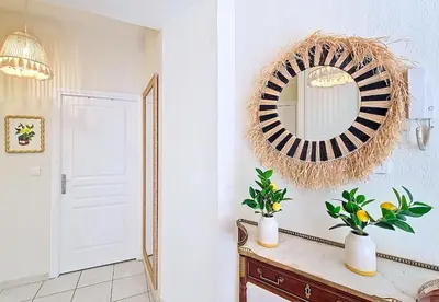 a room with a mirror and a table with plants at Nestor&Jeeves - PALAIS DU PORT - Balcony - Port Place du Pin in Nice