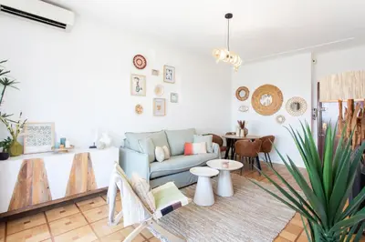 a living room with a couch and a table at L54 1BDR Promenade Sea View AC & Balcony in Nice