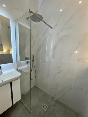 a bathroom with a shower and a sink at LEî in Beaulieu-sur-Mer