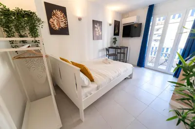 a bedroom with a bunk bed and a ladder at Studios cosy Nice in Nice