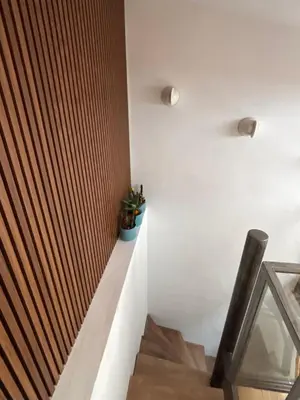 a staircase in a house with white walls at Duplex moderne port de Nice in Nice