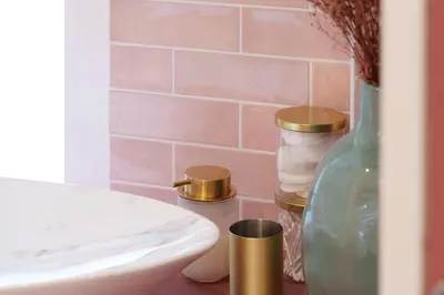 a bathroom with a white sink and a glass bottle at Nice Renting - SPITALIERI - Chic & Cosy Art Deco Nest Nice Étoile in Nice